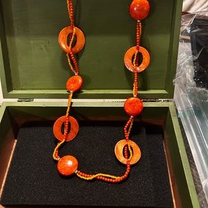Beautiful orange shell and bead necklace.